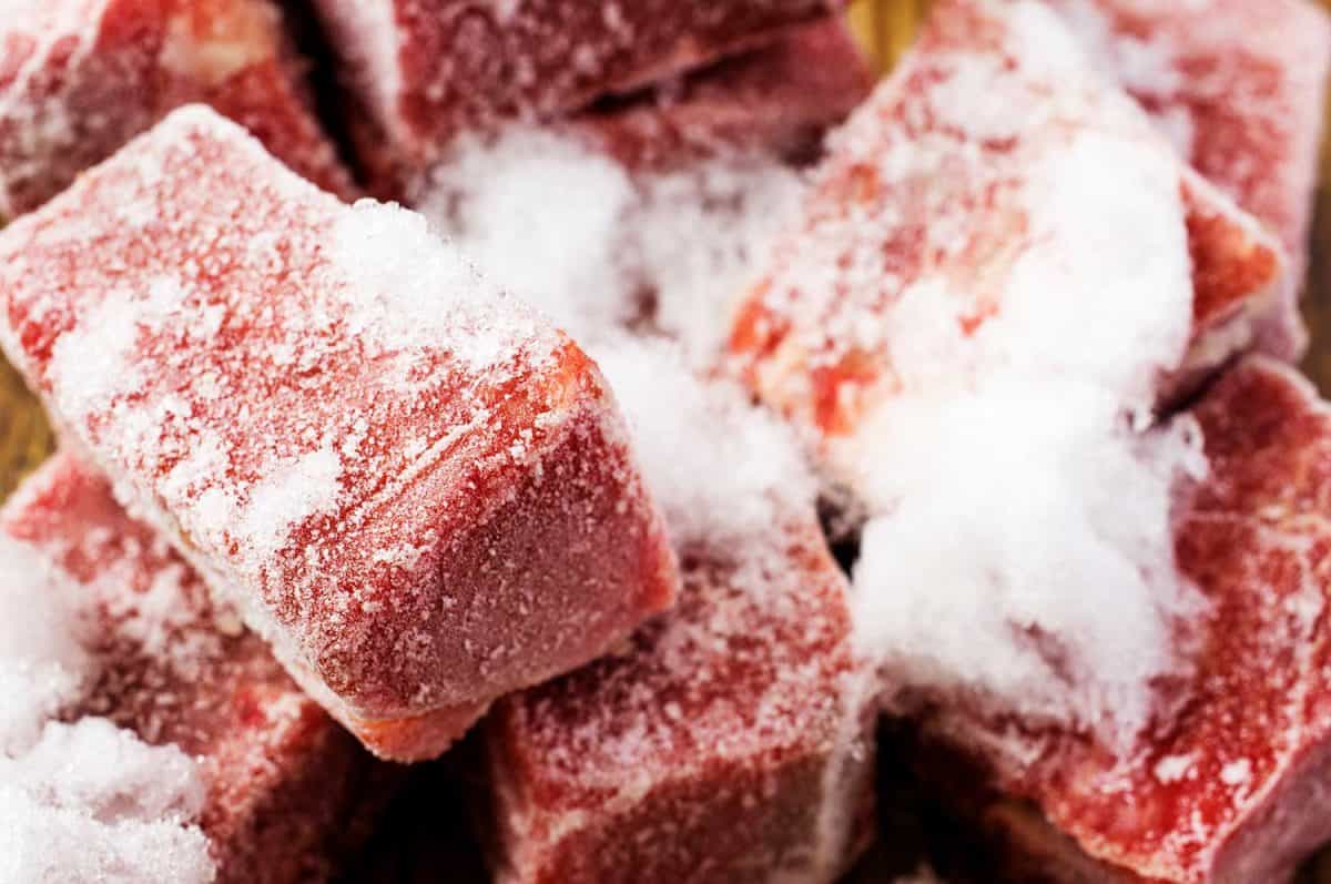 Close up of frozen beef slices in hoarfrost