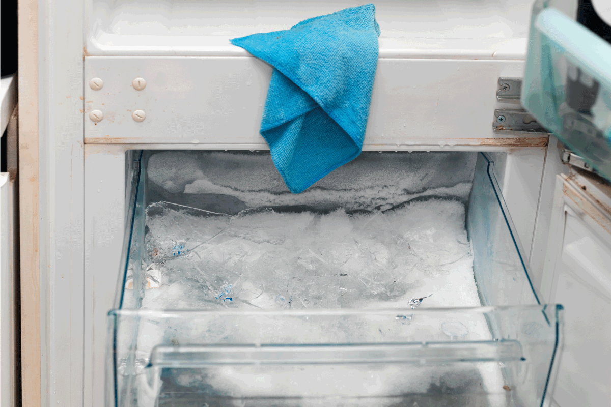 Closeup of fridge and freezer cleaning and defrosting, indoor closeup. Do all freezers have a defrost cycle