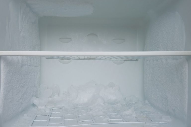 Photo of a freezer with ice building up inside, How To Defrost A Kenmore Chest Freezer