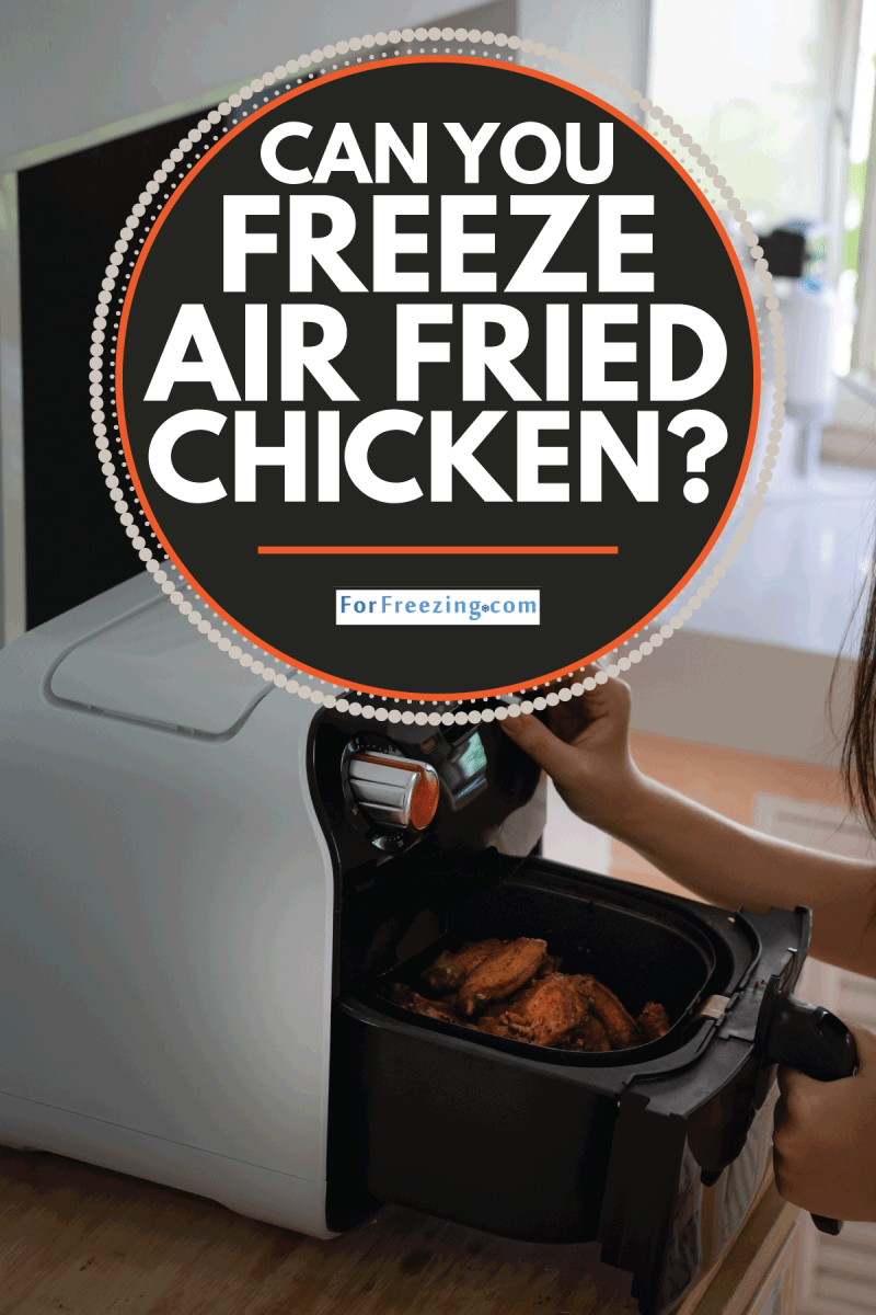 Asian girl cooking a fried chicken by Air Fryer machine in her kitchen at home. Can You Freeze Air Fried Chicken