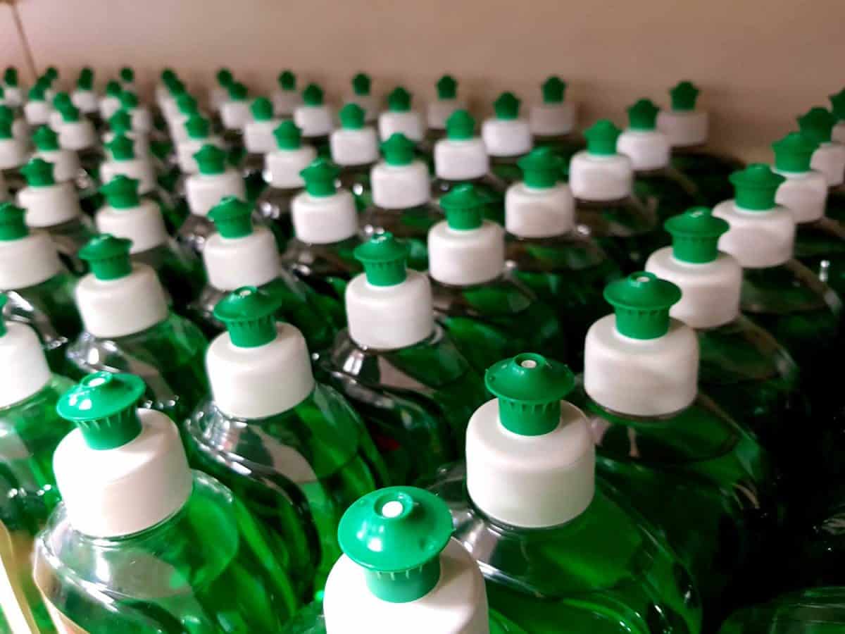 Dishwashing soap bottles on a shelf