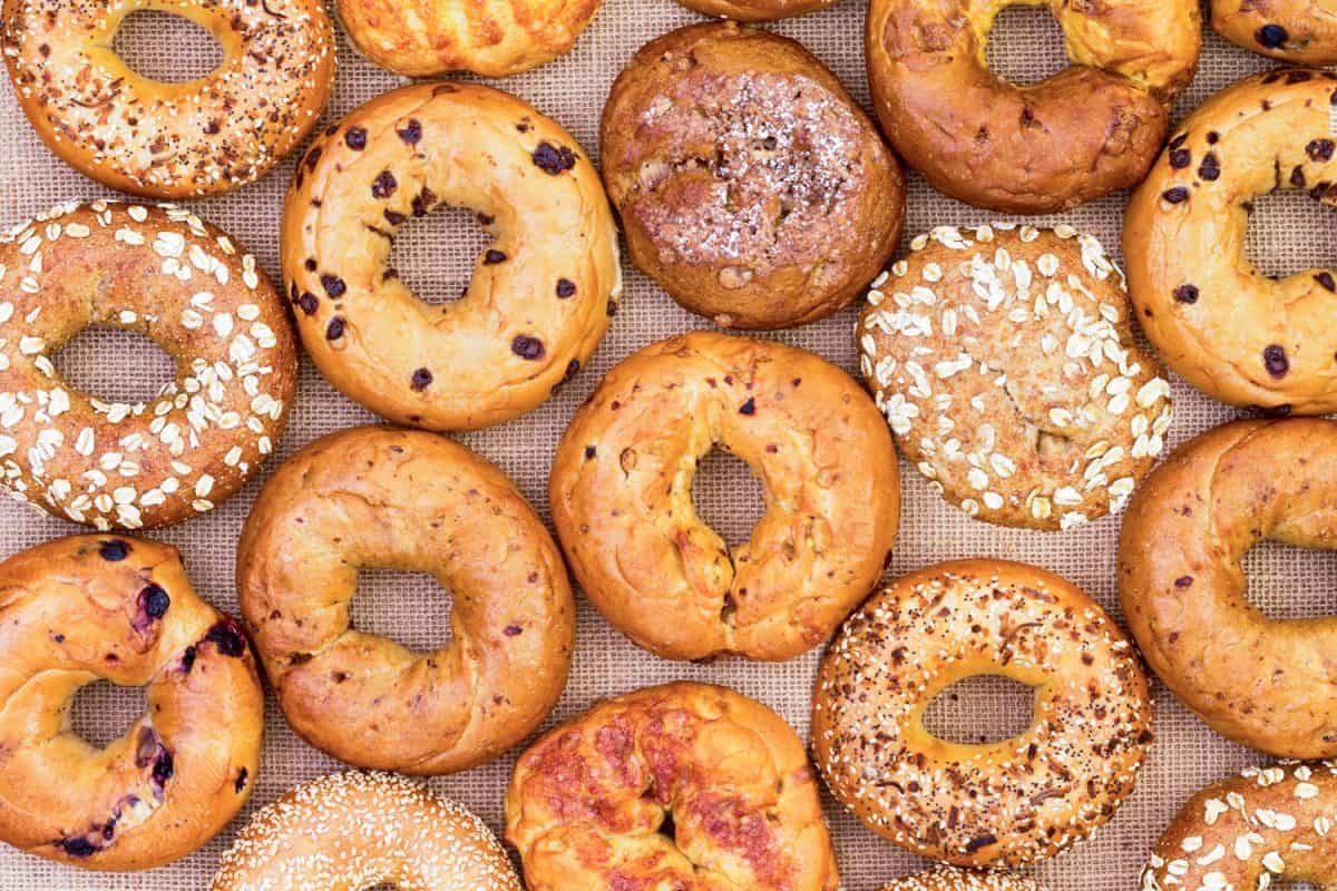 Freshly baked bagels with different kinds of topping and flavors, How To Freeze Bagels The Right Way