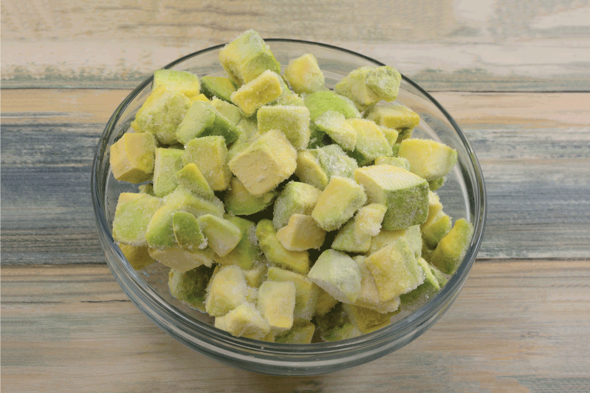 Frozen avocado chunks thawing in glass ingredient bowl on table. Are Frozen Avocados Good For Guacamole
