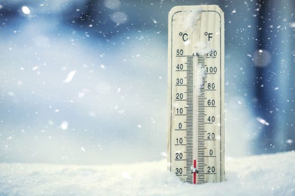 Thermometer on snow shows low temperatures under zero,Will Clothes Dry In Freezing Weather?Will Clothes Dry In Freezing Weather?