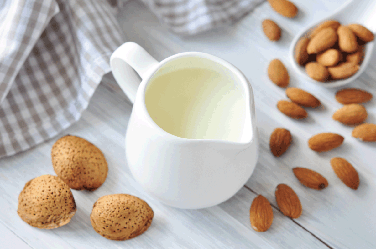 almonds and almond milk in a ceramic container