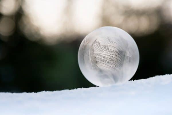 A frozen bubble on top of the snow, Will Bubbles Freeze in Cold Weather?