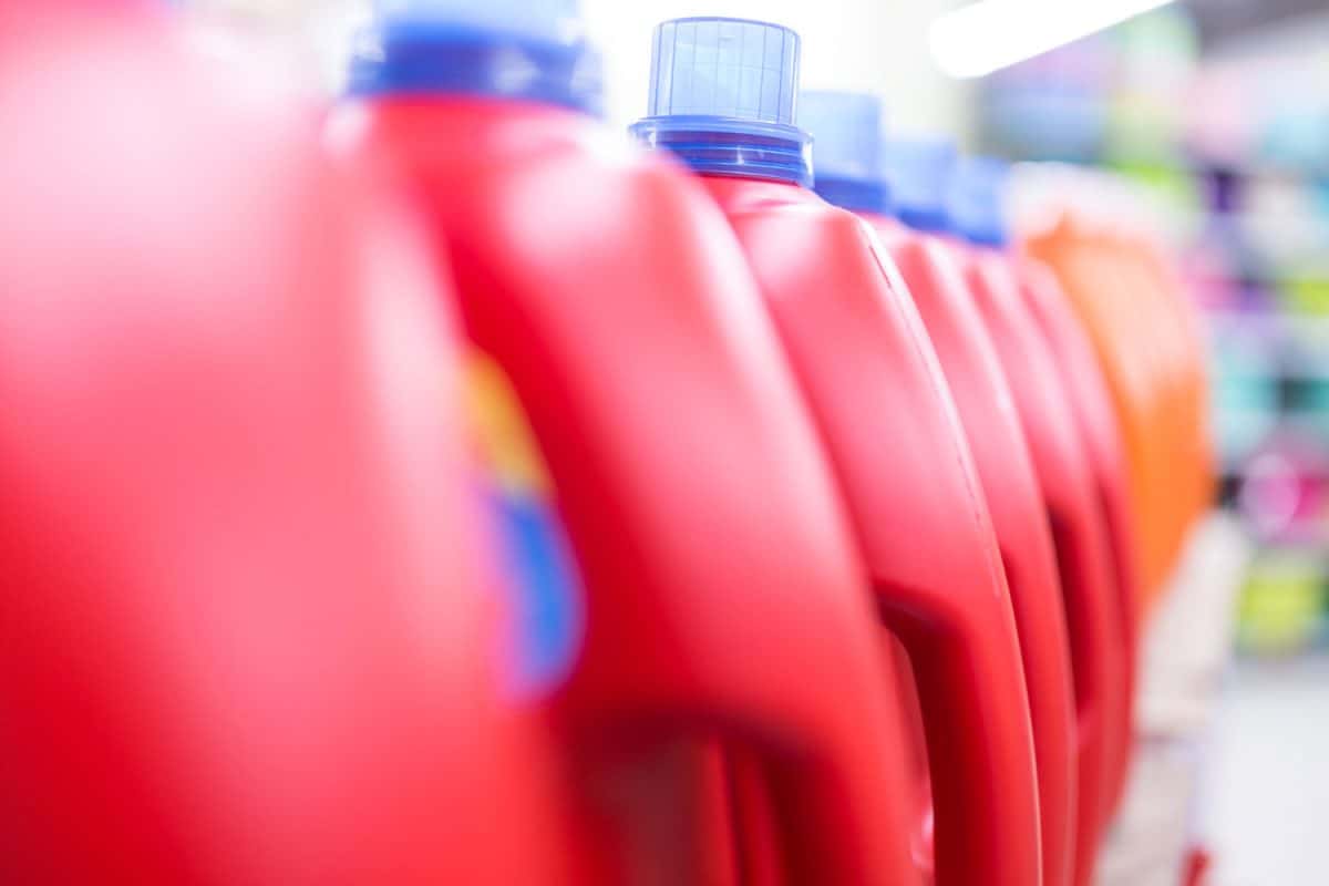 Unrecognizable liquid detergents inside a supermarket