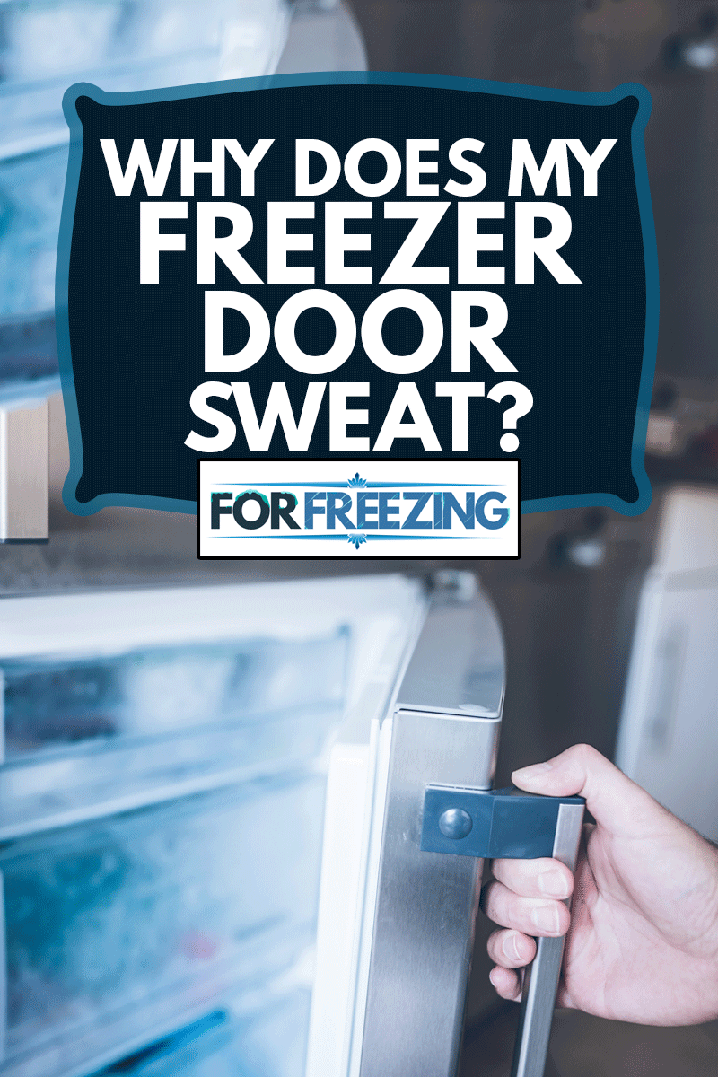 hand of a man opening freezer door in kitchen, Why Does My Freezer Door Sweat?