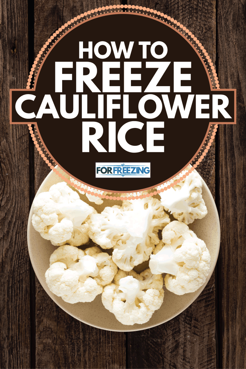 cauliflower on wooden board. Raw cauliflower. How To Freeze Cauliflower Rice