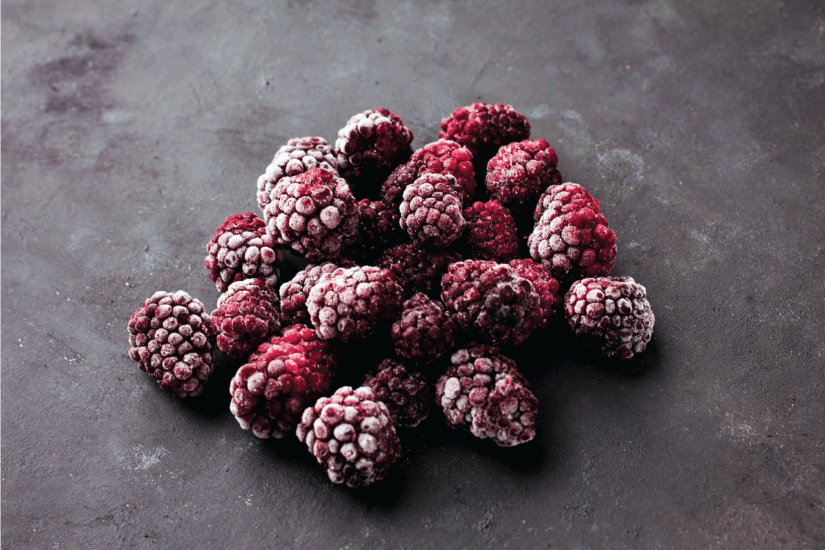 frozen blackberries on a dark background Healthy food vitamins snack dessert