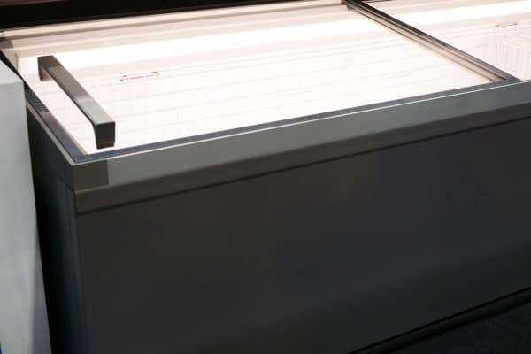 A black colored chest freezer, How Heavy Is A Chest Freezer? [With 11 Examples Of Popular Models!]