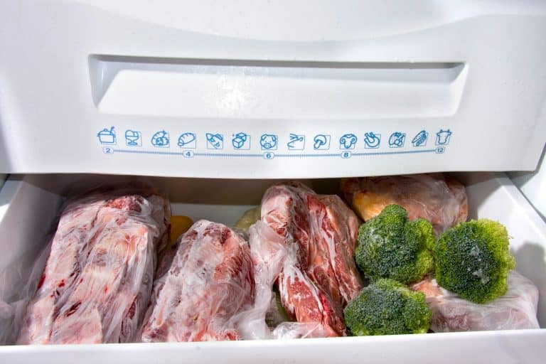 A chest freezer filled with meats and vegetables, Should A Chest Freezer Be Hot On The Outside?