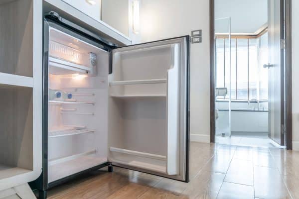 A small fridge in the pantry left open, Damaged Freezer Lining - What To Do?