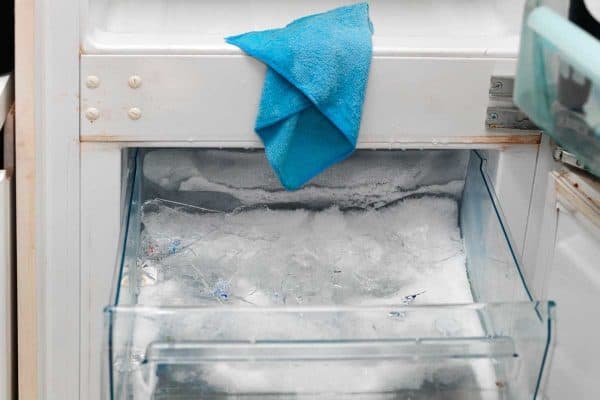 Close up of fridge and freezer cleaning and defrosting, How To Lubricate A Freezer Drawer