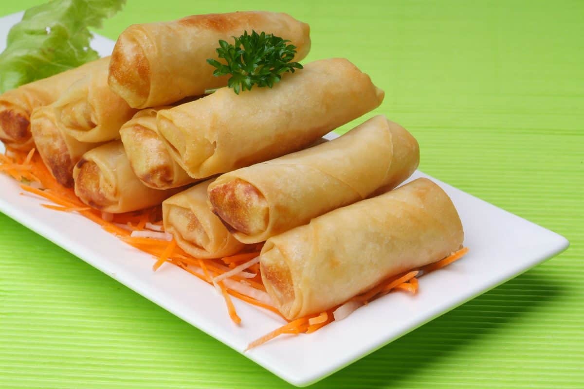 Delicious eggs rolls with small carrot slices on the bottom