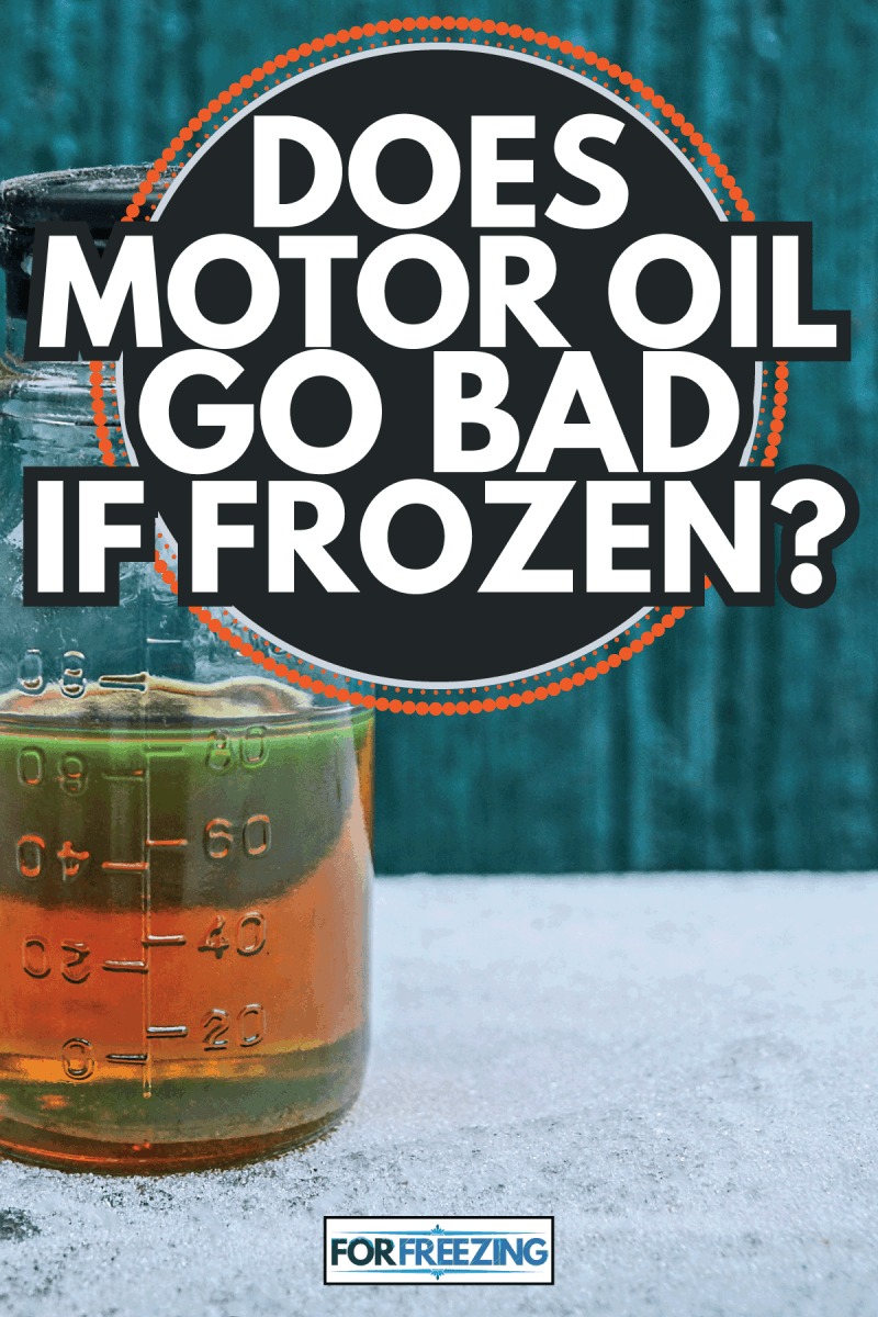 One closed brown liquid from engine oil in a glass bottle on white snow on a green background. Does Motor Oil Go Bad If Frozen