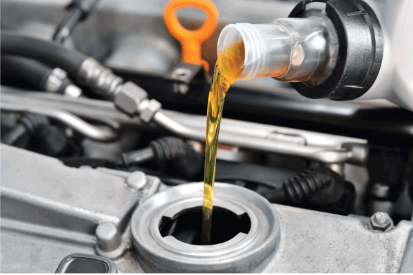 motor oil being poured into the engine from a container. Does Motor Oil Go Bad If Frozen