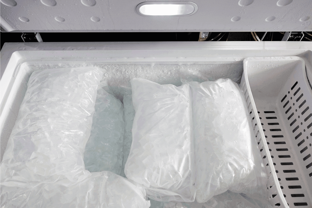 A closeup shot of a chest freezer full of bags of ice. How Noisy And Loud Is A Chest Freezer
