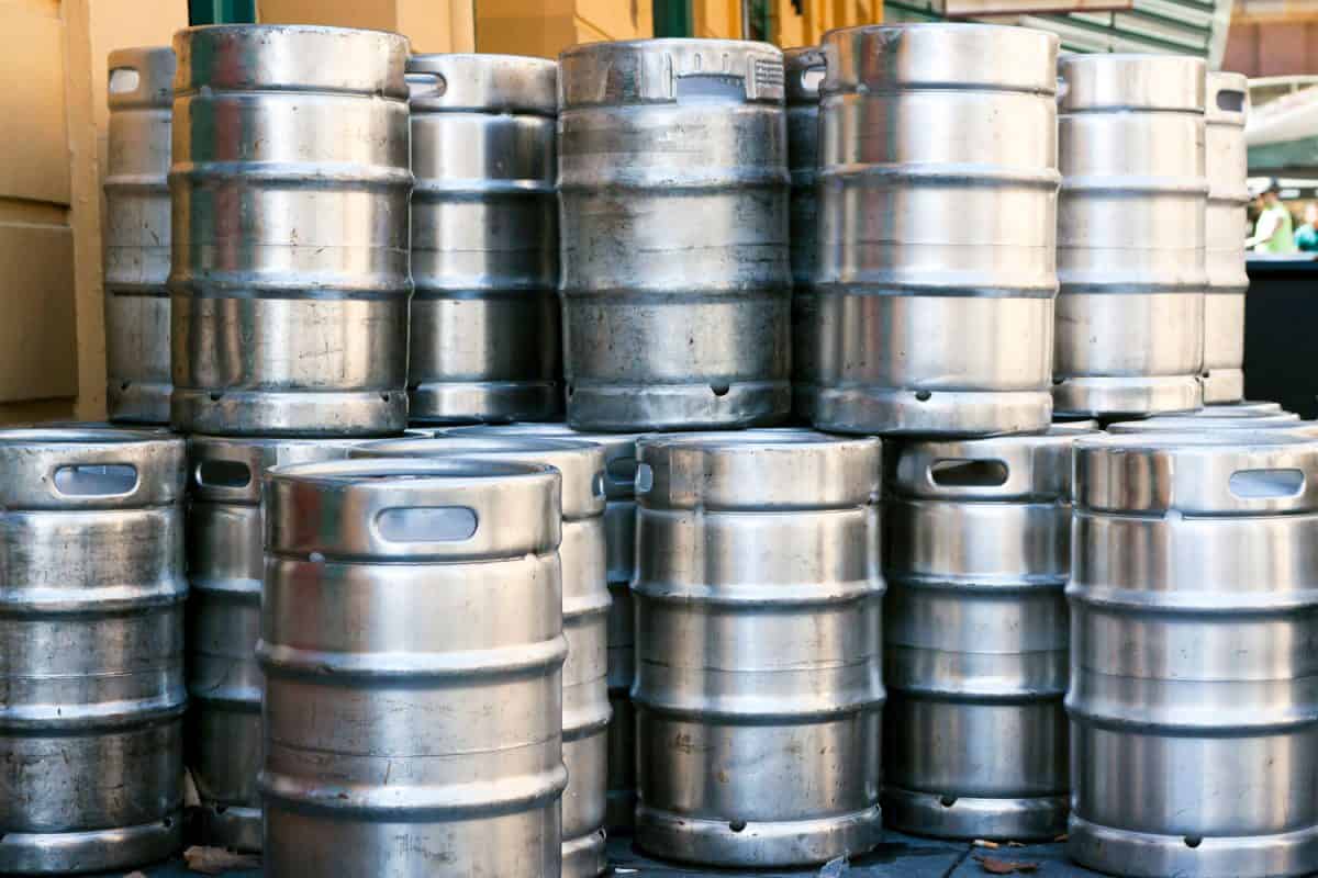 Stainless steel beer kegs stacked and stored in a factory, How Many Kegs Fit In A Chest Freezer?