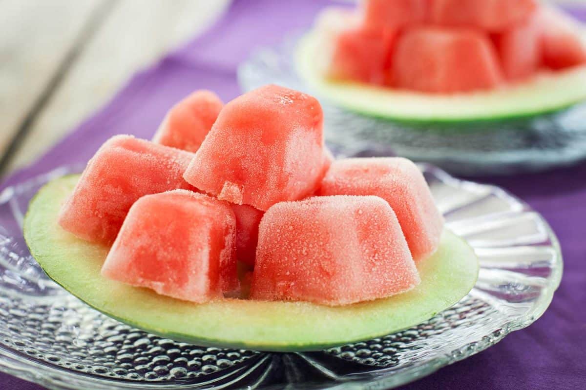 Sweet cubes of watermelon on frozen saucer