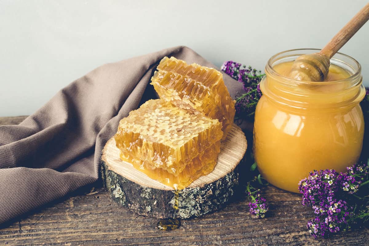Honeycombs and glass pot with honey, How To Defrost Honey?