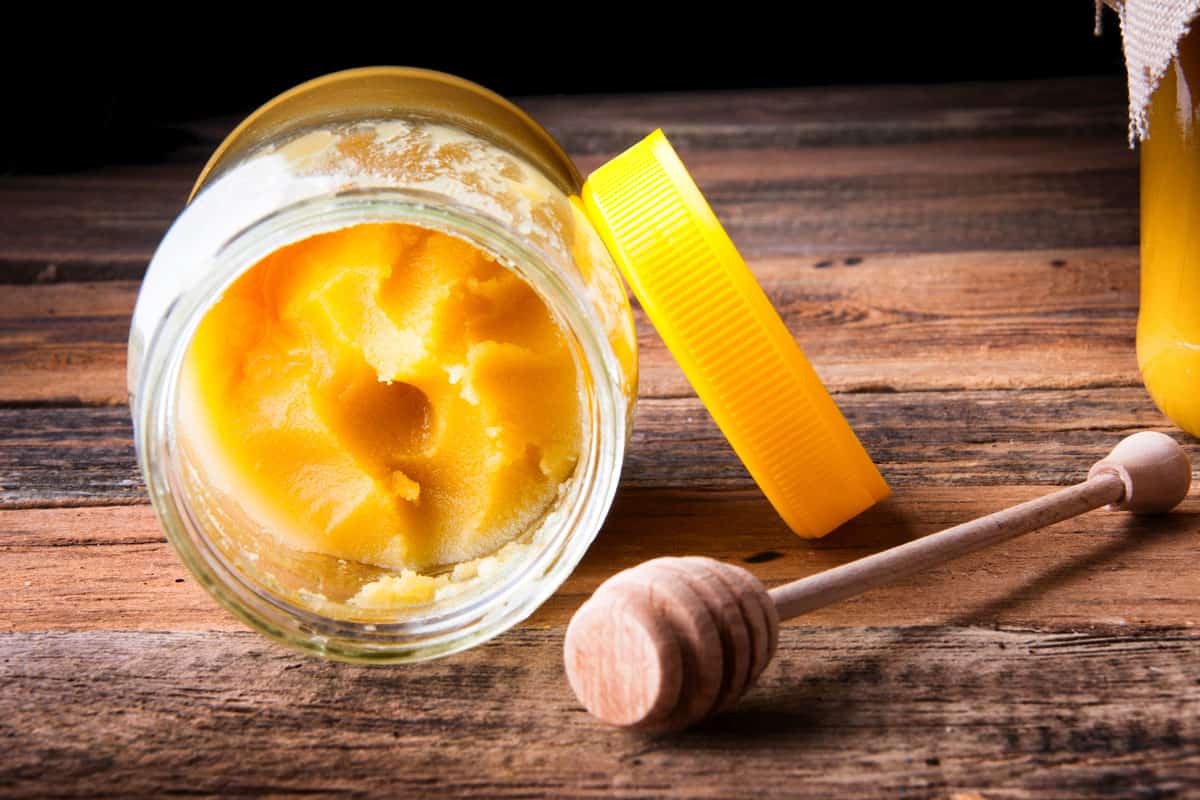 Inside of honey jar with a honey cumb