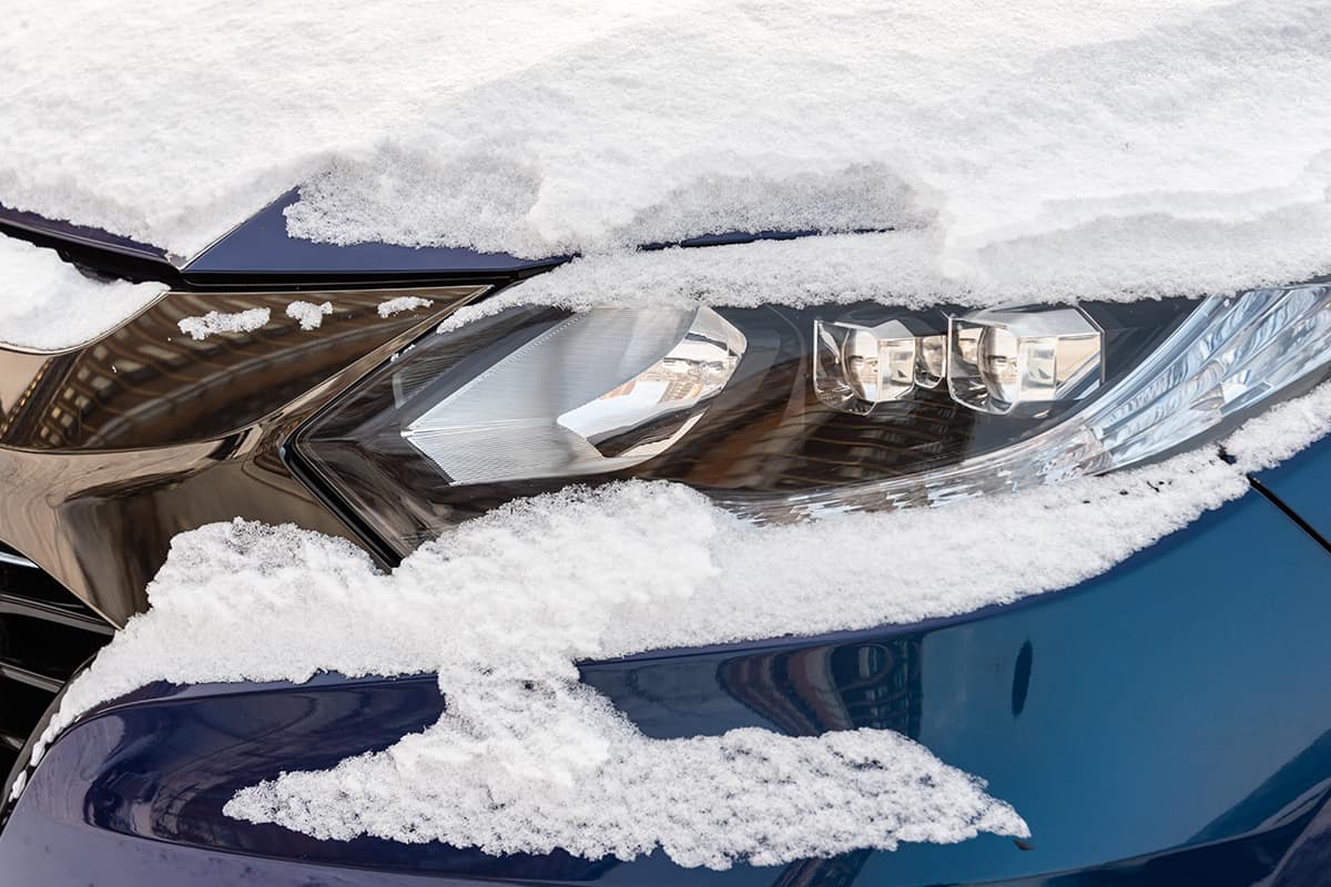 Car headlight under snow