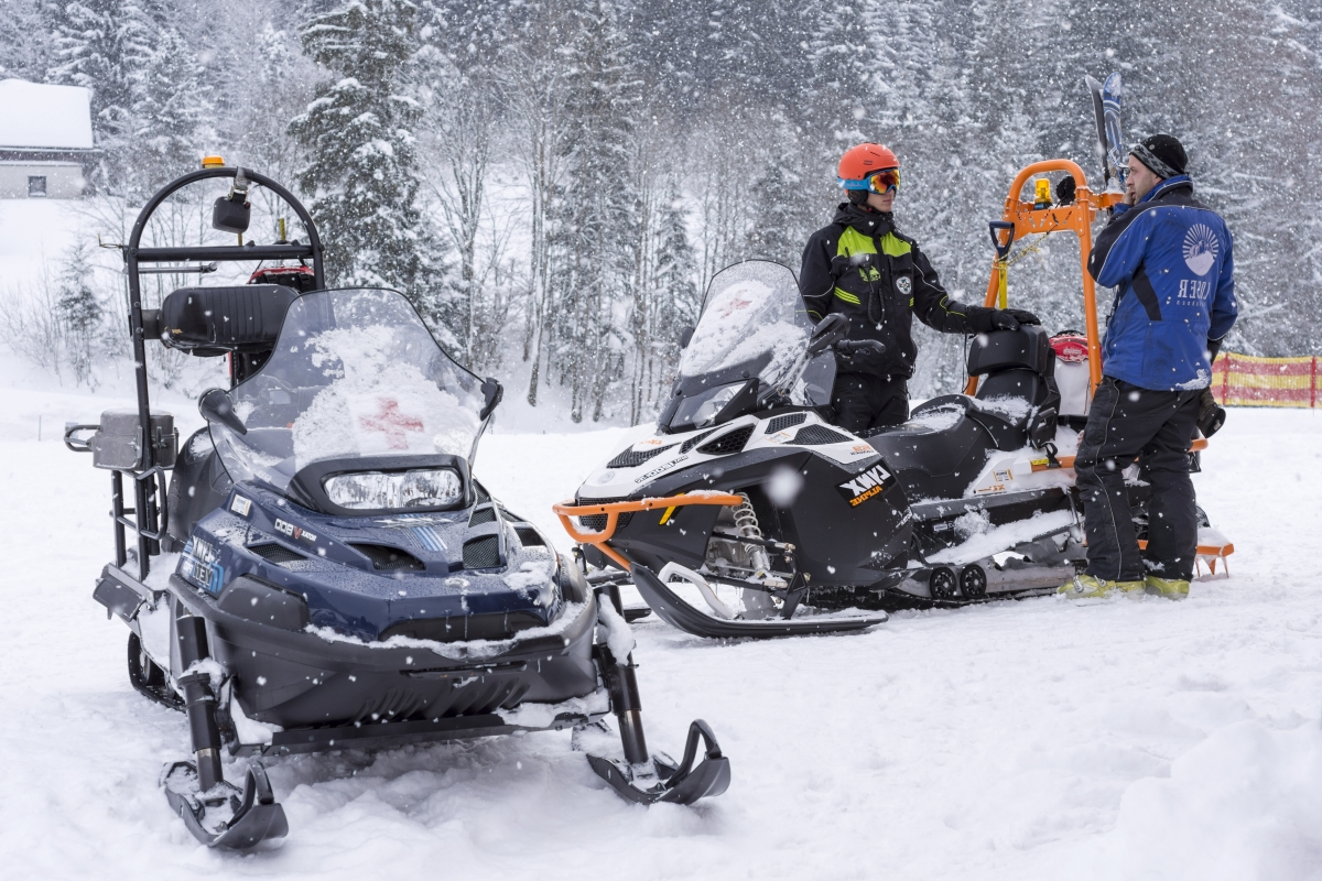 ALTAUSSEE, AUSTRIA - JANUARY 11, 2017  Mountain Assistance Rescue Patrol with Snowmobiles in Ski Winter Season